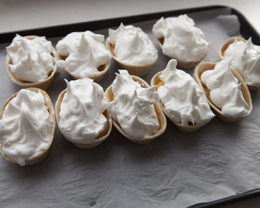 Meringue mixture inside taco boat