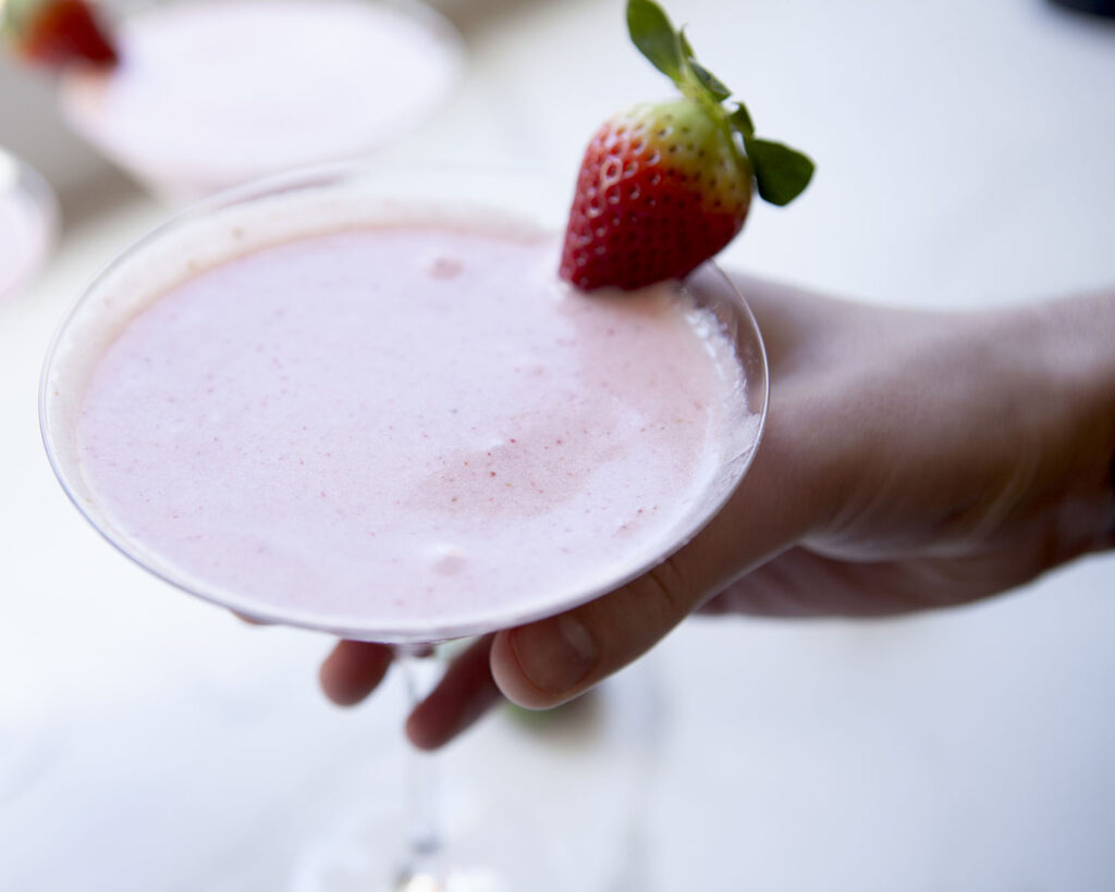 Hands Holding the Strawberry Watermelon Mocktail