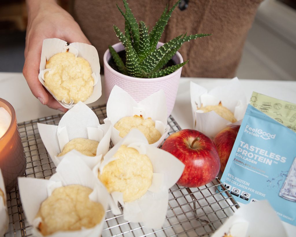 Hand Picking Up the Apple Muffins