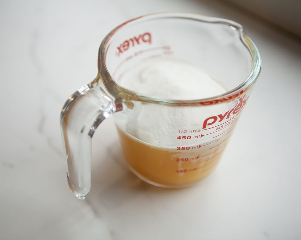 Orange Mixture in Measuring Cup