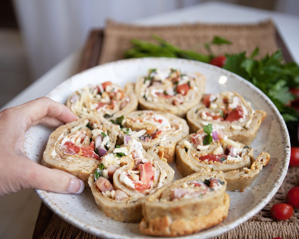 Hand Grabbing Baked Egg Roll