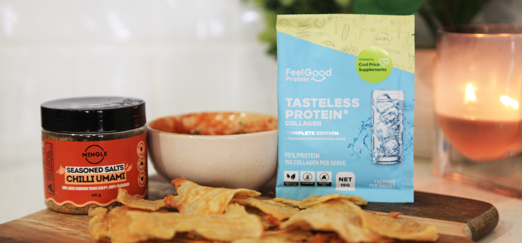 Wooden cook board topped with protein crunch crisps, Mingle Seasoned Salt, assorted dips, and Tasteless Protein Collagen, styled as a clean, natural food spread