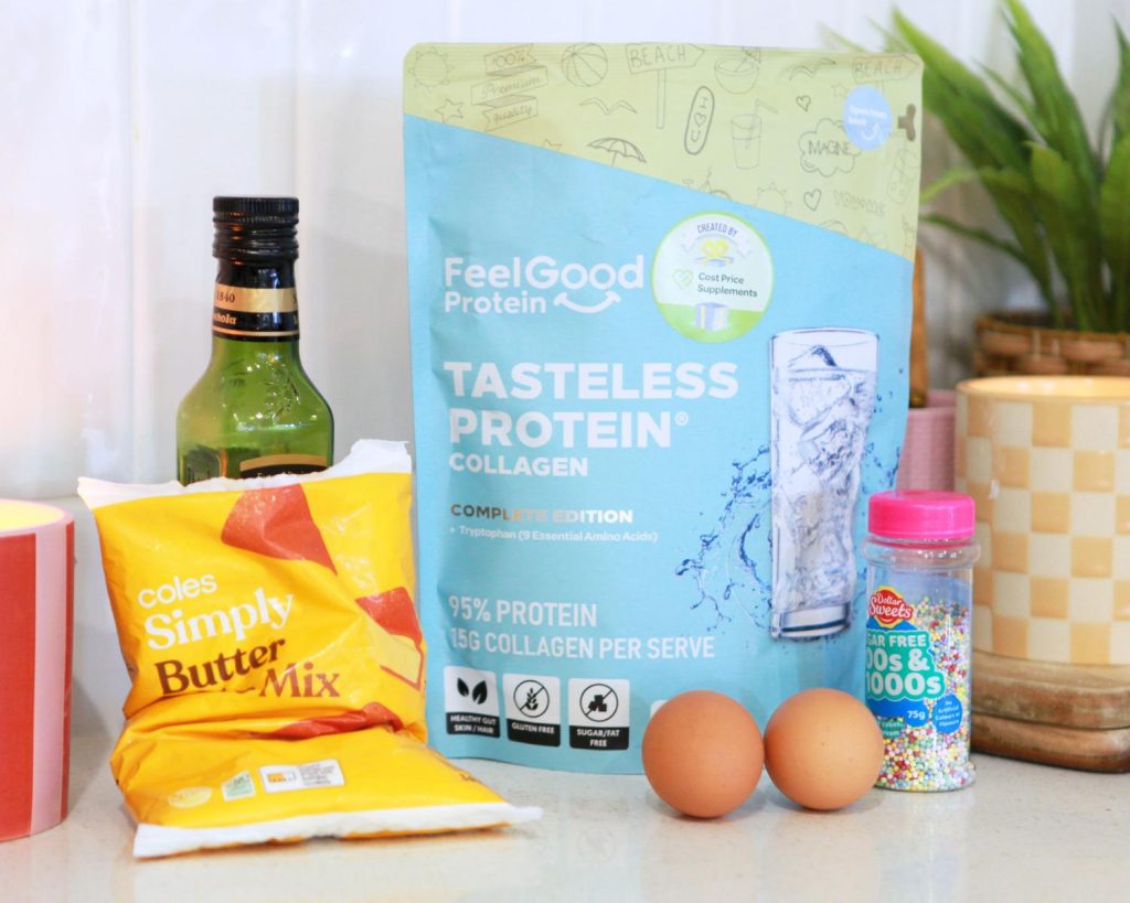 Ingredients for Viral Cake Mix Cookies laid out on a white benchtop, with candles and a pot plant softly blurred in the background.