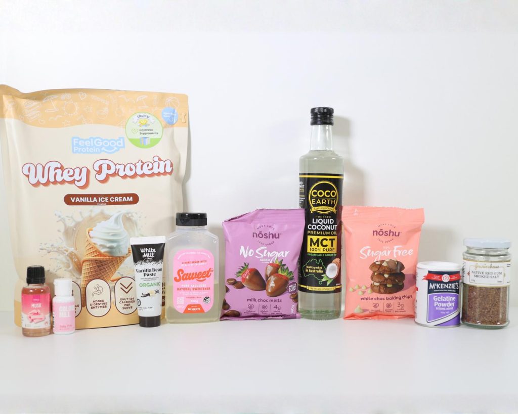 Ingredients for the Marshmallow Easter Egg recipe photographed in a line side by side against a white benchtop and background.