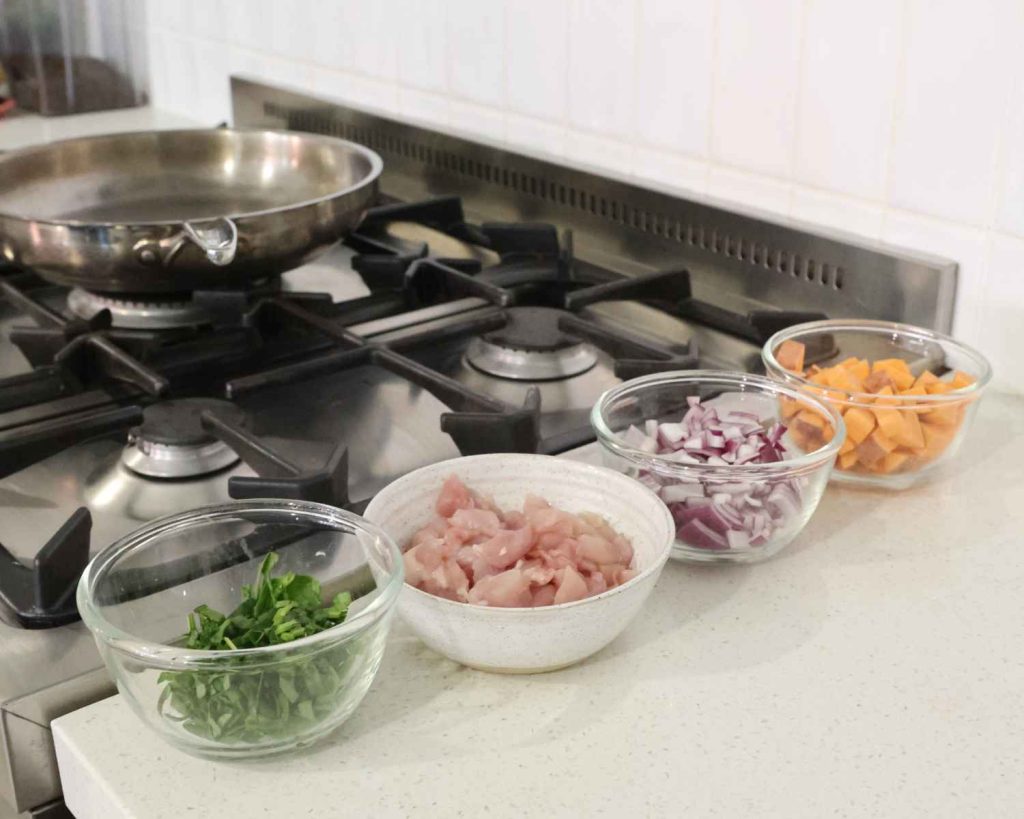 All of the chopped ingredients for the BBQ Chicken & Sweet Potato Muffins recipe ready to cook