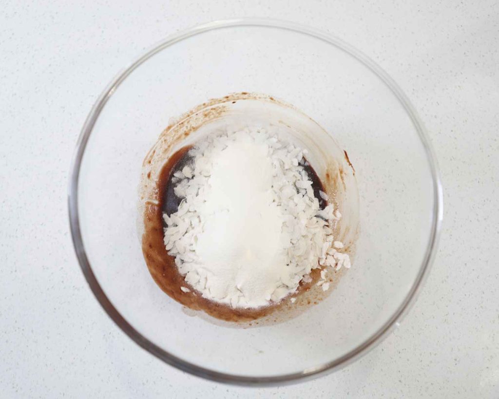 Ingredients in a bowl for the Chocolate Protein Easter Nests recipe before mixing