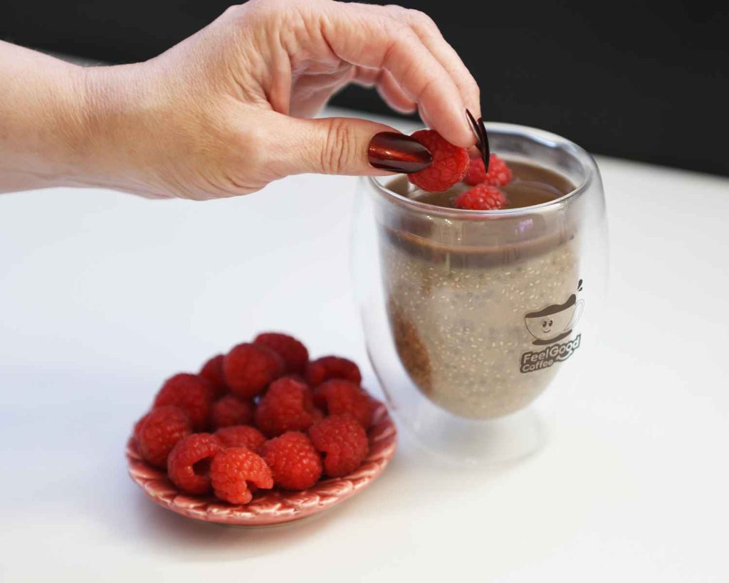 Adding raspberries to the Peanut Protein Chia Pudding recipe