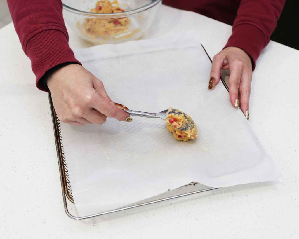 Laying out the cookies on a baking sheet ready to cook