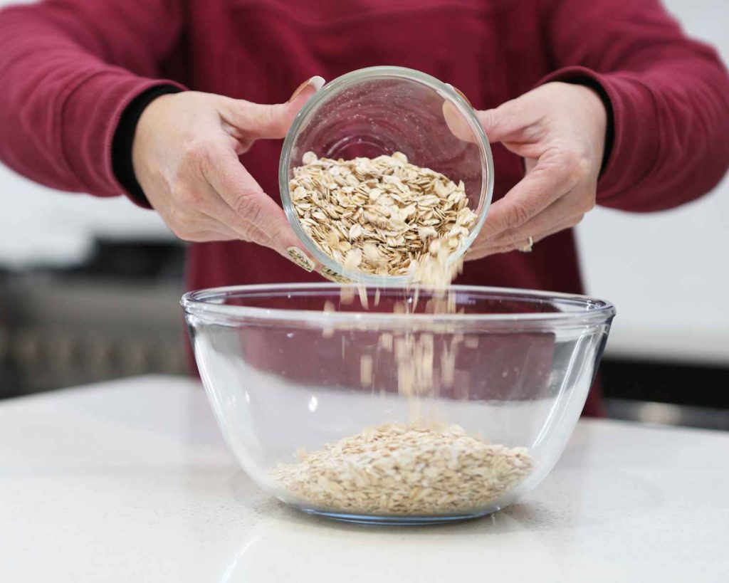 Rolled oats going into a bowl