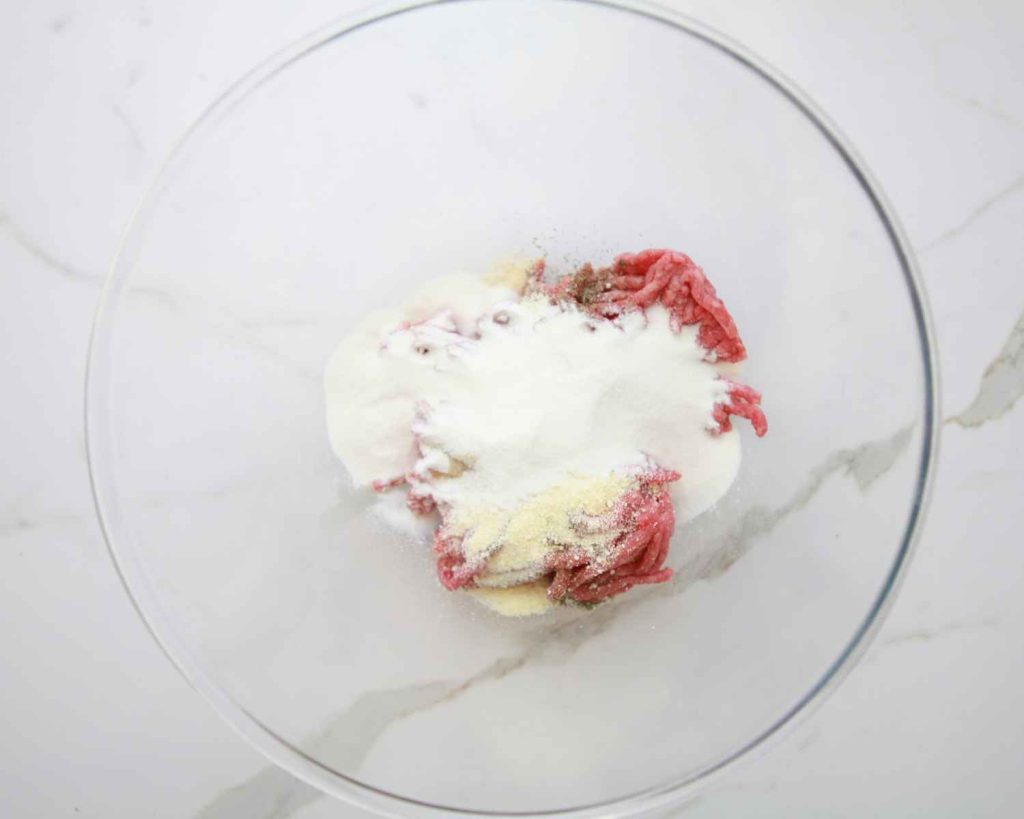 Minced beef and seasonings ready to be mixed