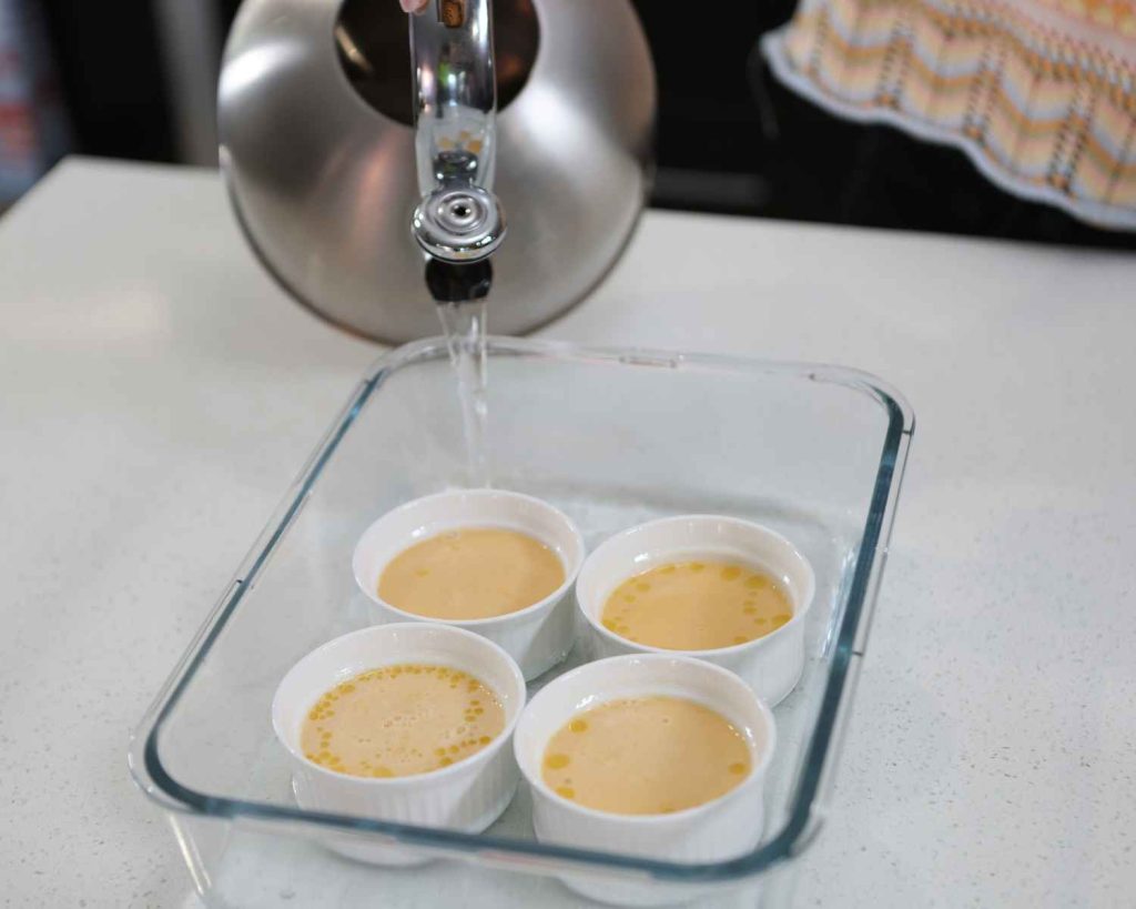 Adding water into the baking dish.
